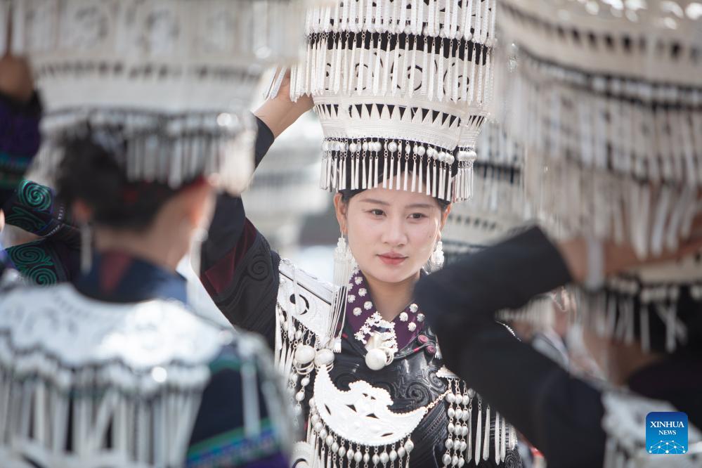 People dressed in traditional Yi costumes celebrate torch festival in China